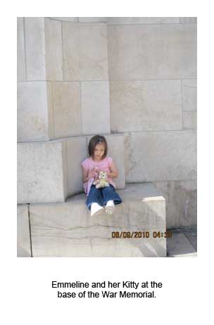 Emmeline and her Kitty at the base of the War Memorial
