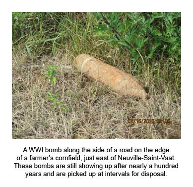 A WWI bomb along the side of a road