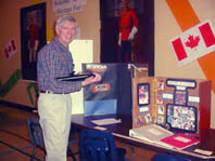 Mr. Shirritt-Beaumont browses the project displays at the Cranberry Portage Heritage Fair.