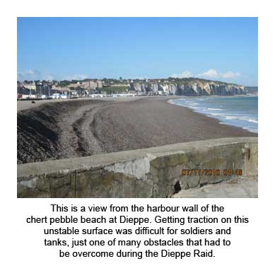 This is a view from the harbour wall of the chert pebble beach at Dieppe